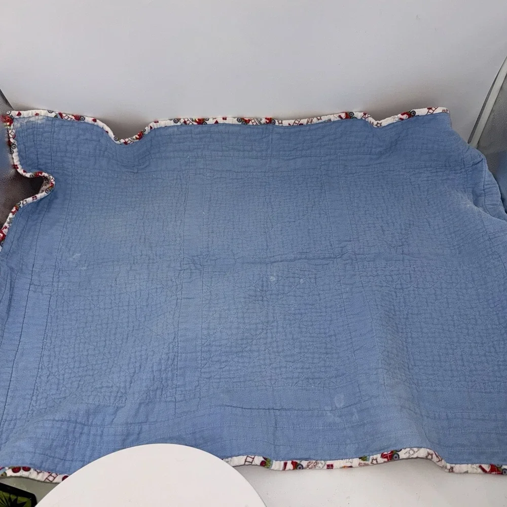 Vtg Baby Quilt Of Trains Print bordered by blue sashing and red cornerstones